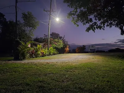 a street light on a pole in a field at Hotel El Cocobolo Food&Rest Room 5 B&B WiFi AC Pkg Free Swimmingpool in Liberia