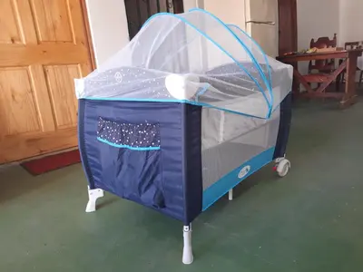 a blue bed with a canopy on top of it at Hotel El Cocobolo Food&Rest Room 6 B&B WiFi AC Pkg Free Swimmingpool in Liberia