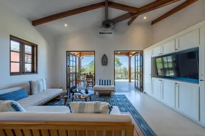 a living room with couches and a flat screen tv at Plaza Mercado 24 At Las Catalinas in Playa Danta