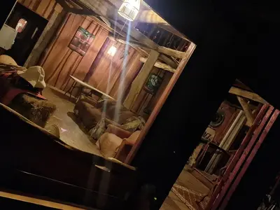 an overhead view of a living room with a mirror at Reserva y Estancia Robles Mimosos Lodge in Cartago