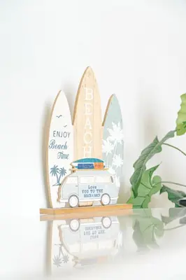 a wooden figurine of a surfboard shaped like a van at Casa Lapa Roja in Playa Hermosa