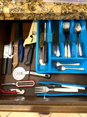 a blue tray filled with utensils on a table at Jaco Hideaway Oasis in Jacó