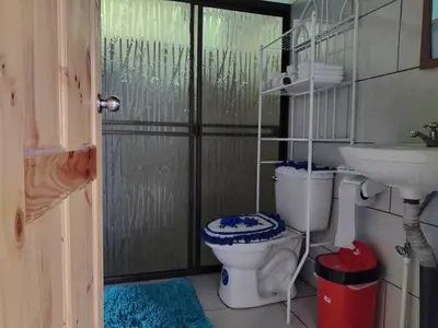 a bathroom with a toilet and a sink at Casa Beli in Monteverde Costa Rica