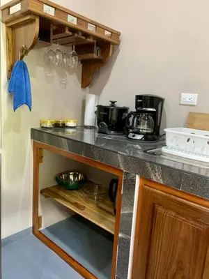a kitchen with a counter top with a counter top at Verde Amanecer in Bijagua