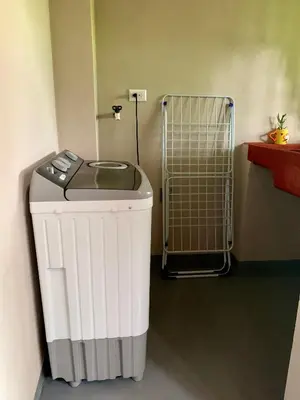 a trash can in a room with a heater at Verde Amanecer in Bijagua
