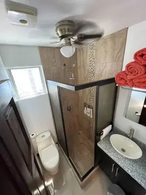 a bathroom with a shower and a toilet and a sink at Casa Encanto Luz del Mar, Con Piscina Privada in Herradura