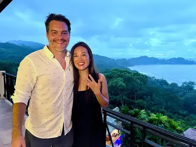 a man and a woman posing for a picture on a mountain at Villa Amor del Mar with Breathtaking View of Ocean & Jungle in Dominical
