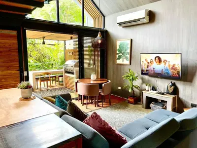 a living room with a couch and a table at Studio Aloha - Malpais in Carmen