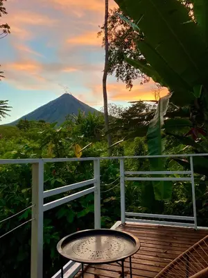 a table on a deck with a view of a mountain at Mali's House in Fortuna