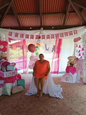 a woman sitting in front of a tent at House Manantial de Vida in Nandayure