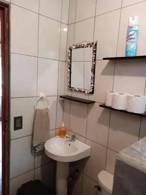 a bathroom with a sink and a mirror at La casita JSL in Ramos