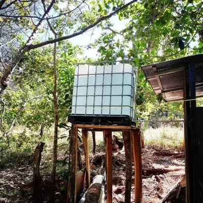 a box sitting on top of a stand in the woods at La casita JSL in Ramos