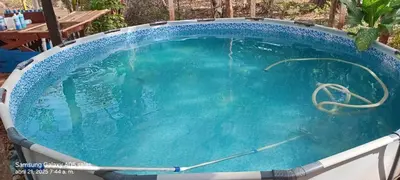 a large swimming pool with blue water in it at La casita JSL in Ramos