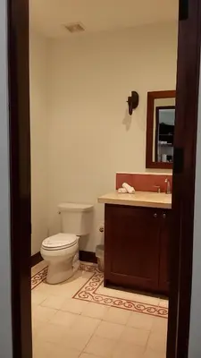 a bathroom with a toilet and a sink and a mirror at Las Catalinas - Studio Cazenovia centrally located, short walk to beach in Playa Danta