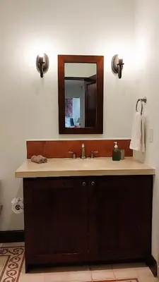 a bathroom with a sink and a mirror at Las Catalinas - Studio Cazenovia centrally located, short walk to beach in Playa Danta