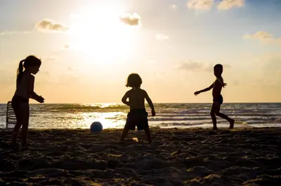 a group of children playing on the beach at Las Catalinas - Studio Cazenovia centrally located, short walk to beach in Playa Danta