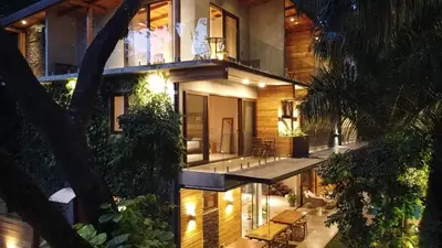 a large house with a balcony with a patio at ARjAU Boutique Hotel - Adults Only in Santa Teresa Beach