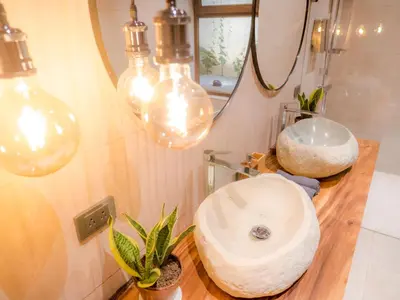 a bathroom with a sink and a mirror at ARjAU Boutique Hotel - Adults Only in Santa Teresa Beach