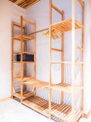 a wooden book shelf in a room at ARjAU Boutique Hotel - Adults Only in Santa Teresa Beach