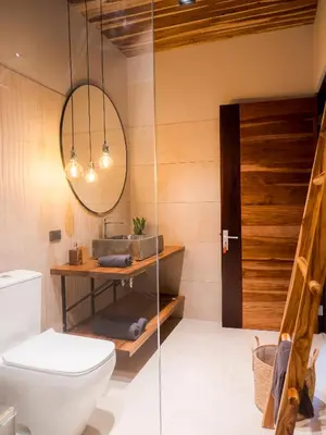 a bathroom with a toilet and a mirror at ARjAU Boutique Hotel - Adults Only in Santa Teresa Beach