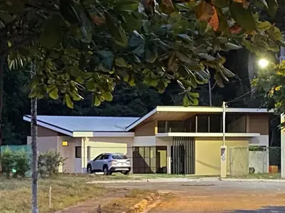 a building with a car parked in front of it at Villa Lapa in Agujas