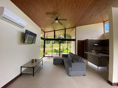 a living room with a couch and a table at Villa Lapa in Agujas