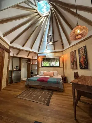 a bedroom with a bed in a tent at Tierra Encantada Wellness Center in Nosara