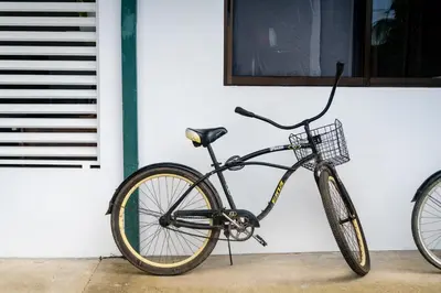 a bike parked in front of a building at Hotel Por Que No? in Uvita