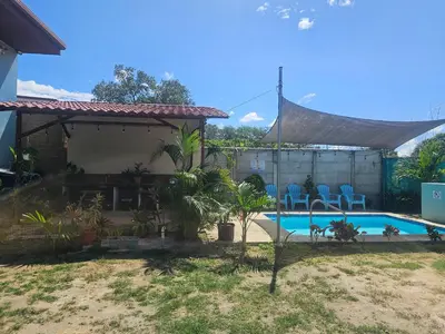 a house with a swimming pool in the yard at Casa Luna, espacio moderno y acogedor in Liberia
