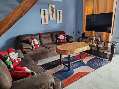 a living room with a couch and a table at Casa Hortensia in Nicoya