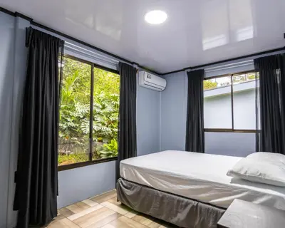 a bedroom with a bed and a window at La Casa del Tío Carlos in San Pedro