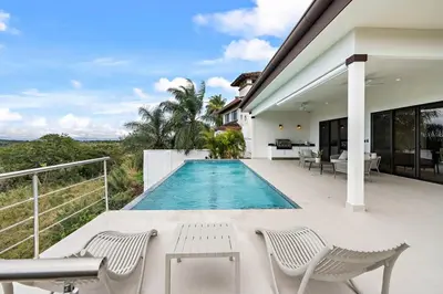 a swimming pool on the deck of a house at Mountaintop 4-Bedroom with Pool Huge Views in Carpintero