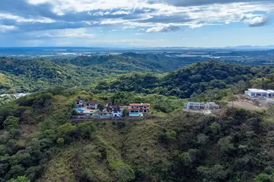 an aerial view of a house on top of a hill at Mountaintop 4-Bedroom with Pool Huge Views in Carpintero