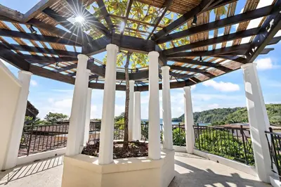 a pergola with a view of the water at Stylish Beach-Themed Condo with Two Bedrooms and Lovely Ocean Views in Playa Danta
