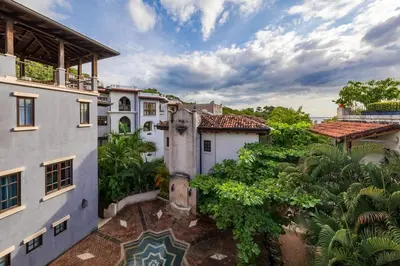 an aerial view of a house with a courtyard at Beautiful Mediterranean-Style Penthouse with an Oceanview Balcony in Playa Danta