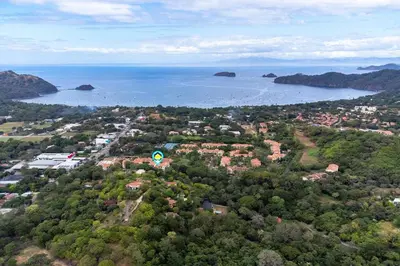 an aerial view of a town and the ocean at Stunning Top-Floor Condo with Sweeping Ocean & Mountain Views & Beach Club in Coco