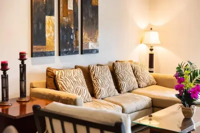 a living room with a couch and a table at 3-Bedroom 2-Bath Condo Overlooking Pool in Coco