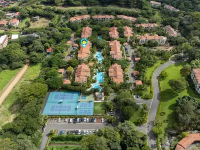 an aerial view of a resort with a pool at Luxe 3-BD Condo on 2nd Floor Above Pool in Coco