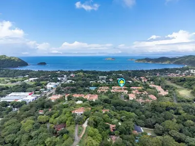 an aerial view of a town with trees and water at Luxe 3-BD Condo on 2nd Floor Above Pool in Coco