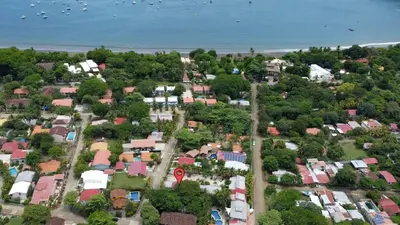 an overhead view of a city with houses and the ocean at Bright and Spacious Loft-Style Apartment a Five-Minute Walk to the Beach in Coco