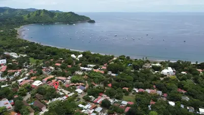 an aerial view of a town next to a body of water at Bright and Spacious Loft-Style Apartment a Five-Minute Walk to the Beach in Coco