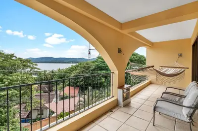 a balcony with a view of the water at Newly remodeled unit in Flamingo with sweeping ocean views from big terrace in Playa Flamingo