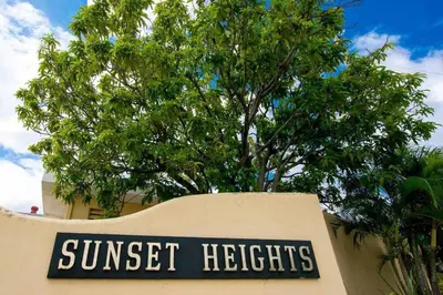 a sign for a suntrust heights building with a tree at Newly remodeled unit in Flamingo with sweeping ocean views from big terrace in Playa Flamingo