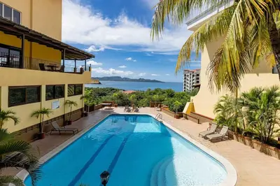 a swimming pool in the middle of a building at Newly remodeled unit in Flamingo with sweeping ocean views from big terrace in Playa Flamingo