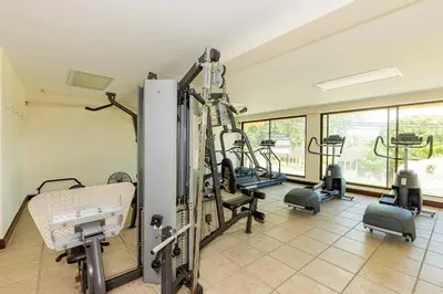 a gym with treadmills and machines in a room at Newly remodeled unit in Flamingo with sweeping ocean views from big terrace in Playa Flamingo