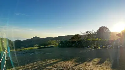 a view of a field with the sun in the background at Campo Azul #3 - Monteverde in Monteverde Costa Rica