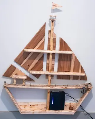 a wooden boat on a shelf in a room at Las Carmelas, Airport Juan Santamaría, Alajuela, San José in Alajuela City