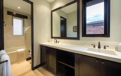 a bathroom with a sink and a large mirror at Calle La Ronda 15 At Las Catalinas in Playa Danta