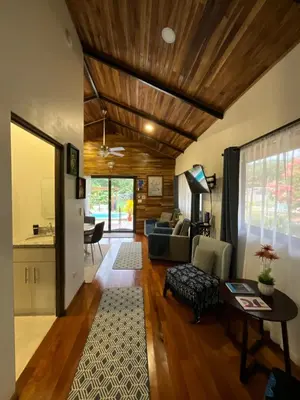 a living room with a couch and a table at Casa Cooper in Carrillo