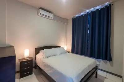 a small bedroom with a bed and a window at Villas Fortuna Boutique in Fortuna